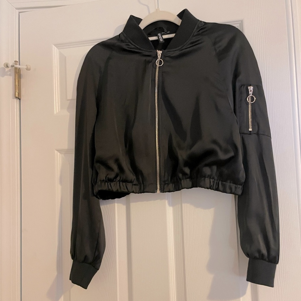 H & M Divided black silky jacket! Has nice sheen. Elasticized waist. Gold zip.